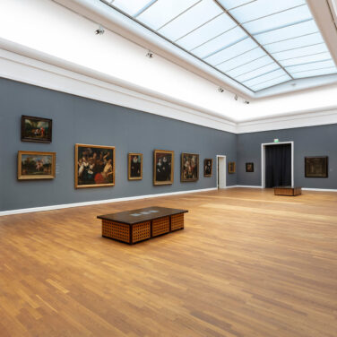 View into a grey painted exhibition room in the KunstWelten.